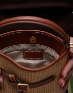 woven structured bucket bag with buckle detail in tan