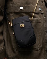 mini nylon cross body bag in black and gold
