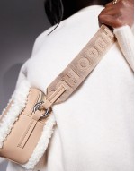 bel crossbody bag in beige with sherpa lining detail