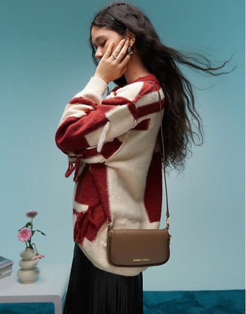leather cross body bag in dark taupe