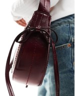 half moon shoulder bag with side bow detail in burgundy