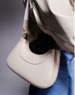 curved logo shoulder bag in cream