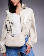 curved logo shoulder bag in cream